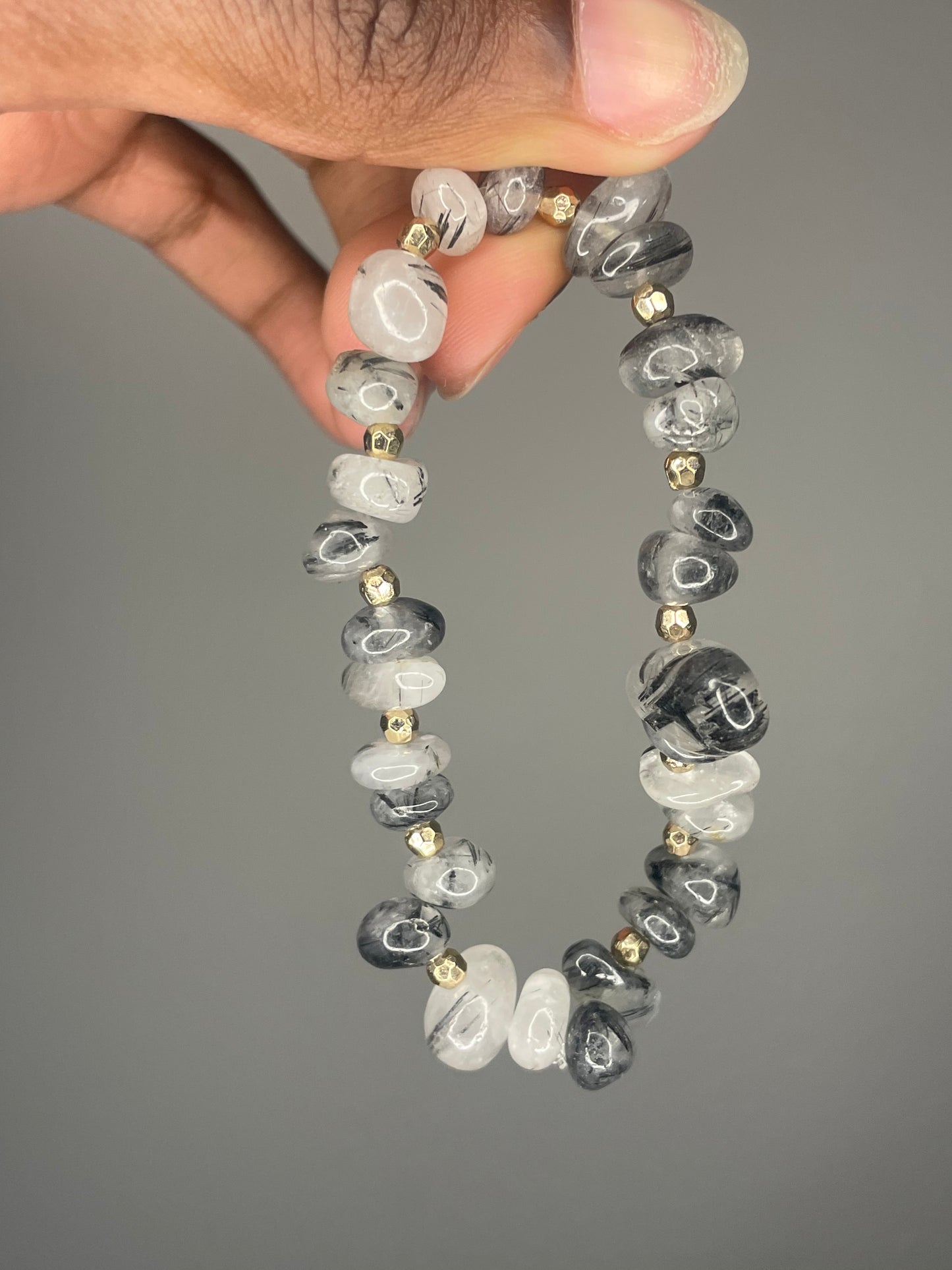 Gold and grayish bracelet