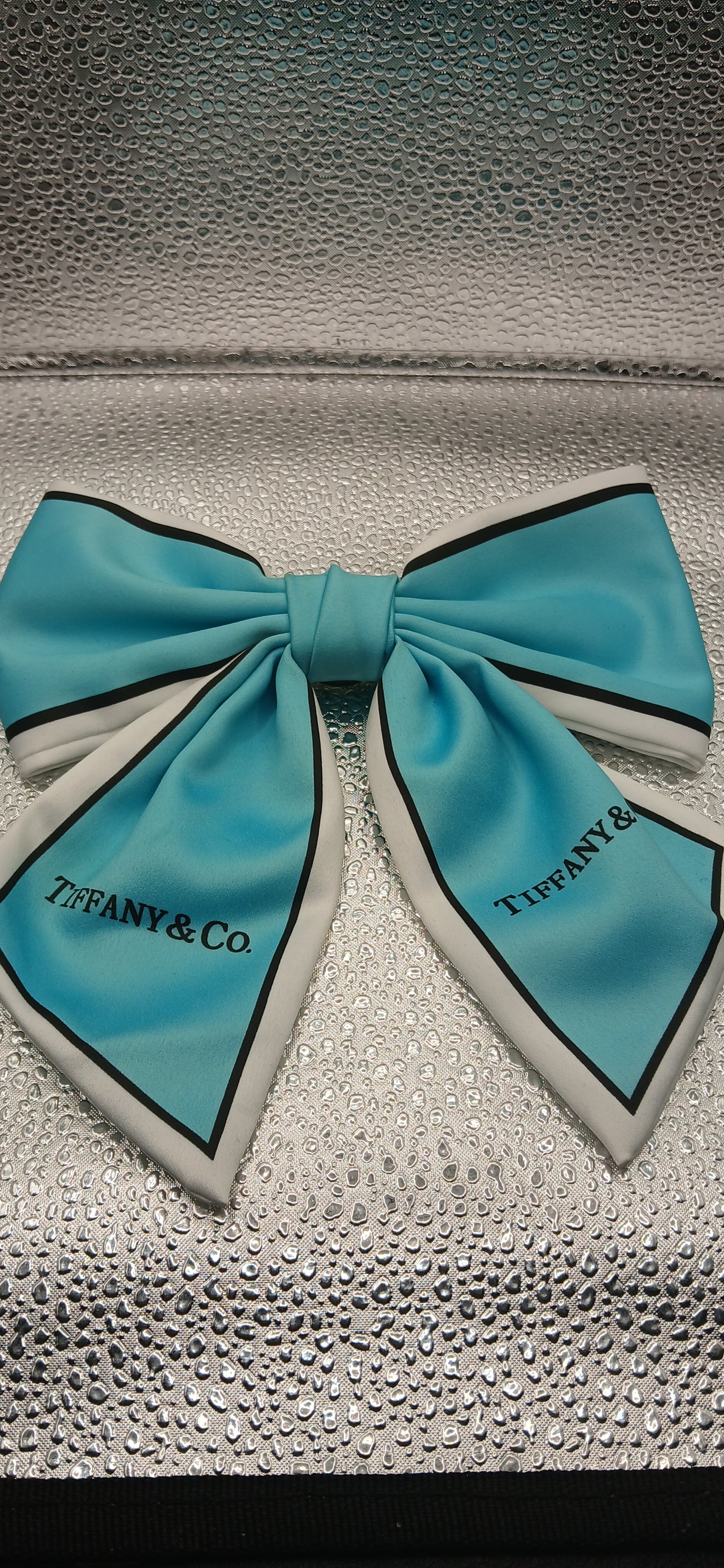 Blue t brooch